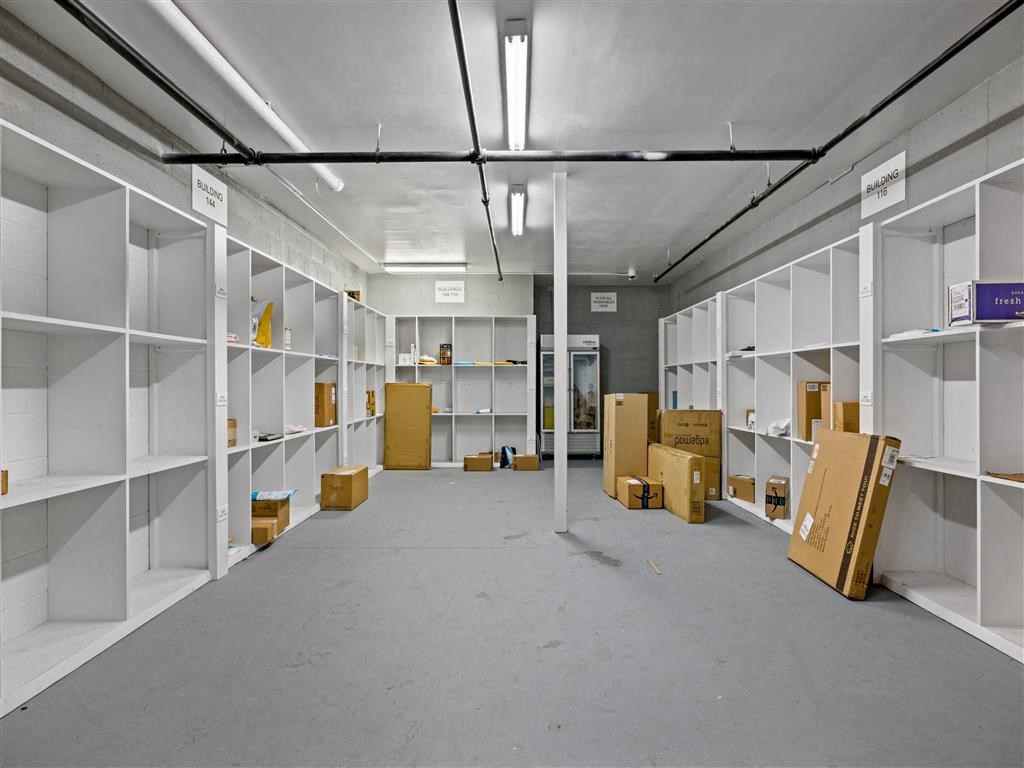a room filled with boxes and shelves in a warehouse
