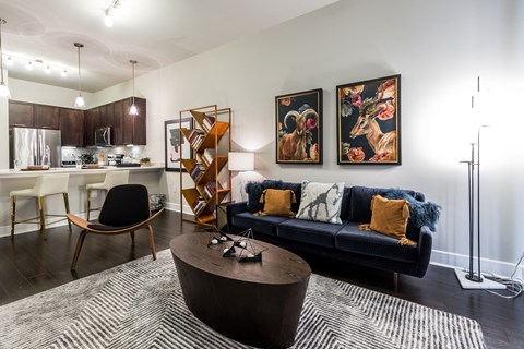 a living room with a blue couch and a coffee table