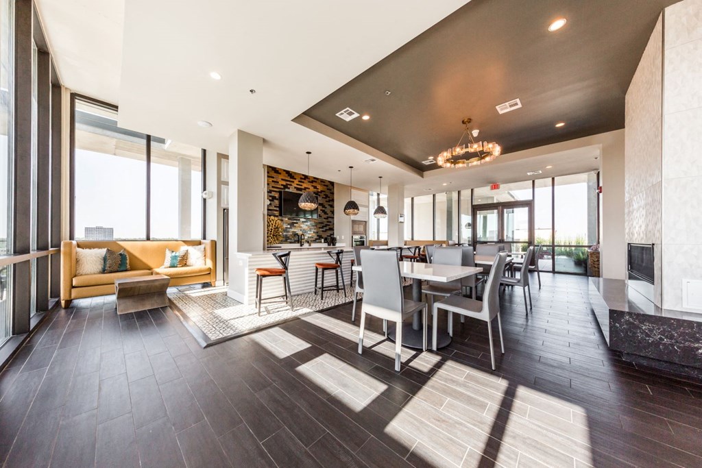 a dining room and living room with a table and chairs