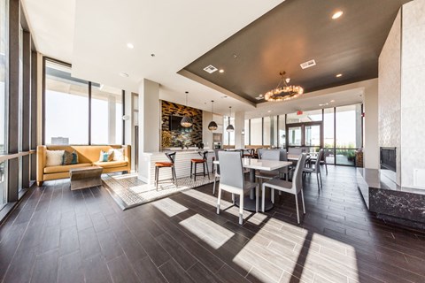 a dining room and living room with a table and chairs
