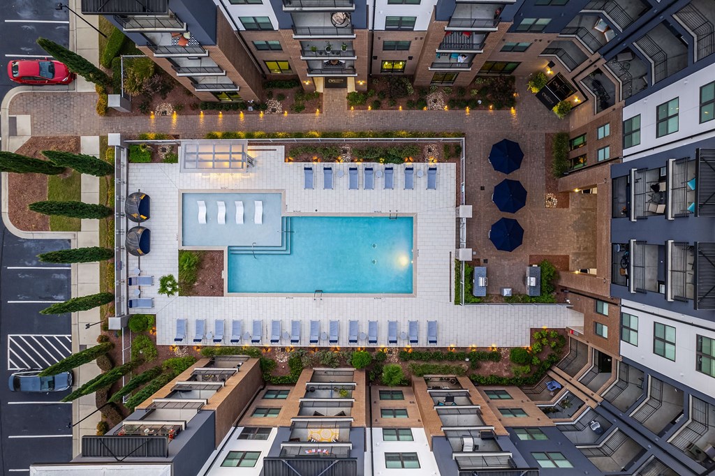 a rendering of an apartment building with a swimming pool