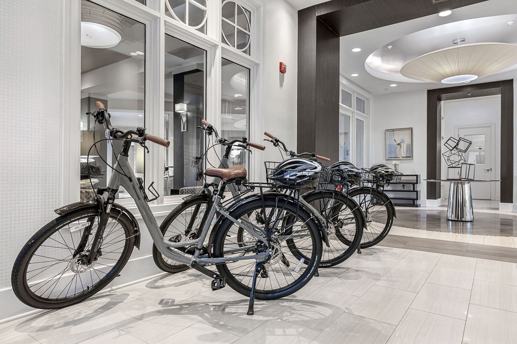 a row of bikes parked in a lobby