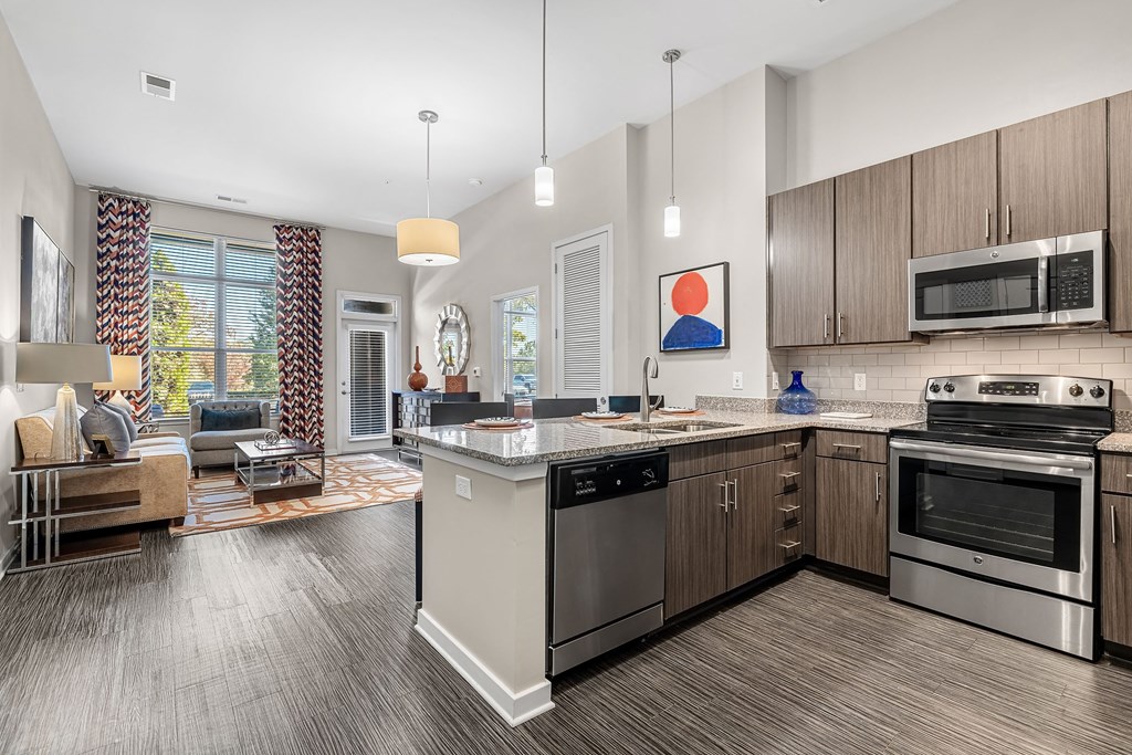 a kitchen with stainless steel appliances and a counter top