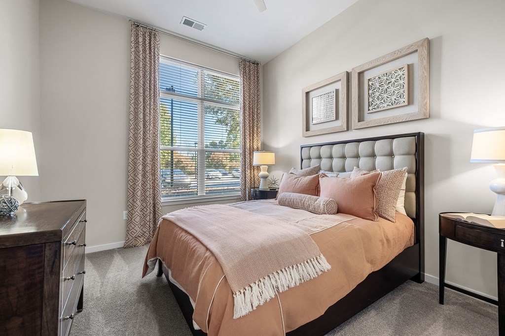 a bedroom with a bed and a window