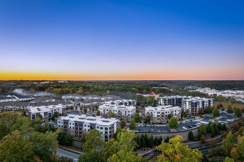 an aerial view of a city with buildings and trees