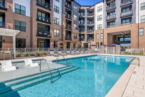 our apartments have a large pool and lounge chairs