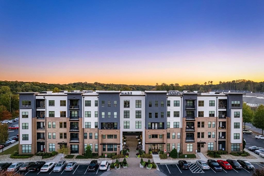 an aerial view of an apartment building at dusk