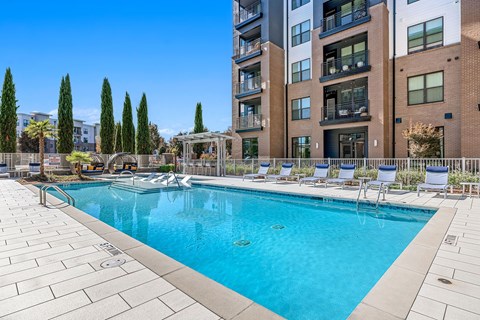 a screenshot of a city with a pool of water