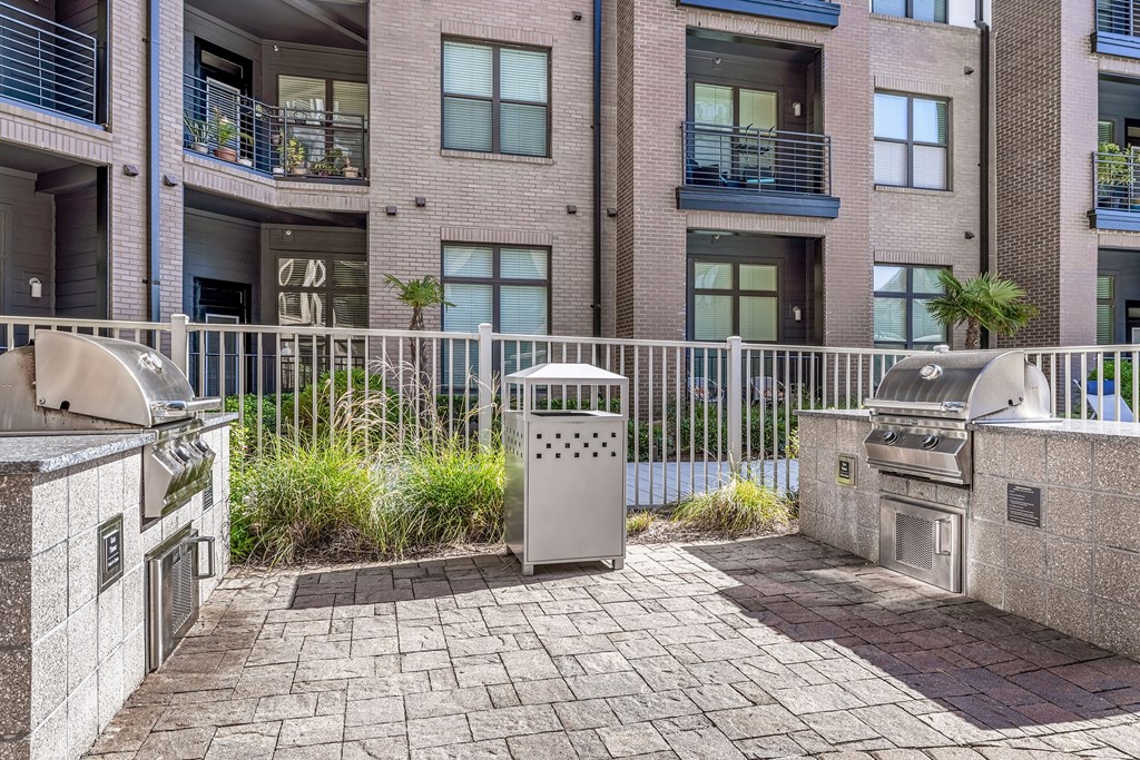 our apartments have an outdoor patio with a grill and barbecue areas