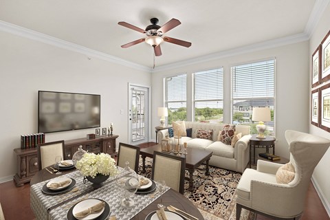 A well-lit dining room with a table set for a meal.