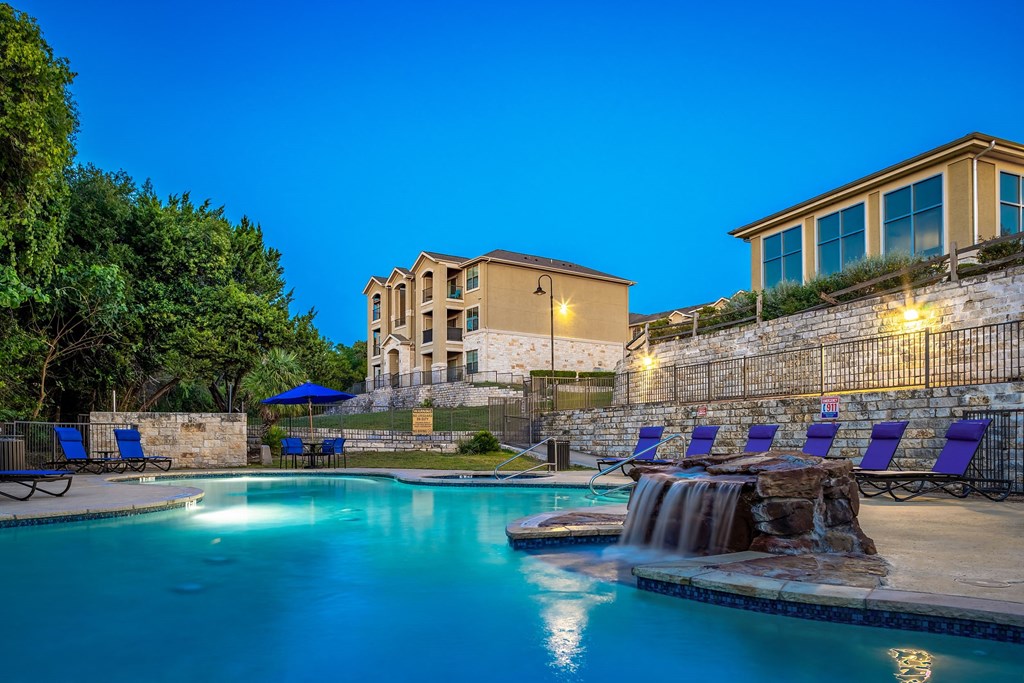 the swimming pool at night at the resort at governors crossing