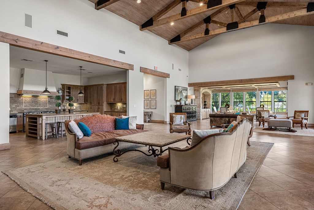 the living room is open to the kitchen and dining room