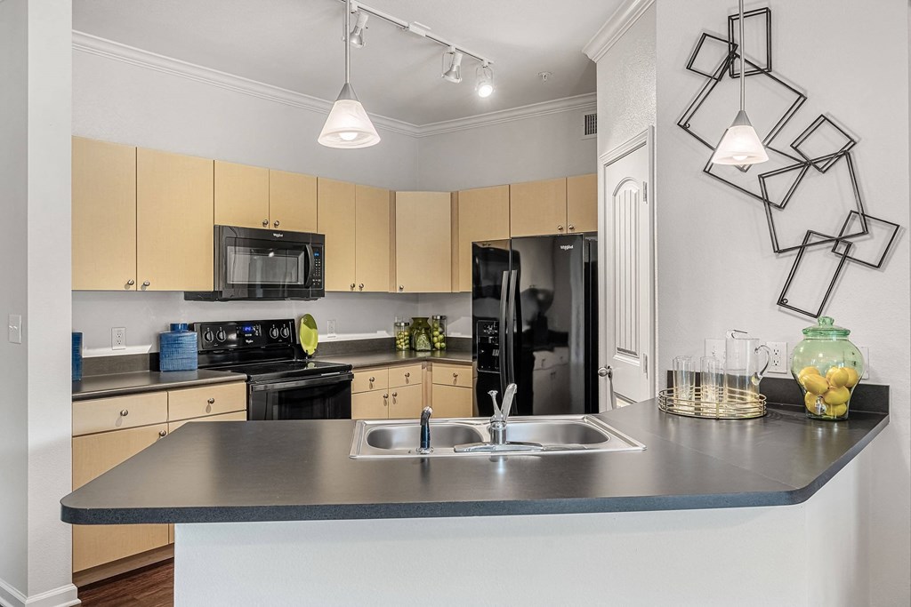 a kitchen with a counter top and a sink