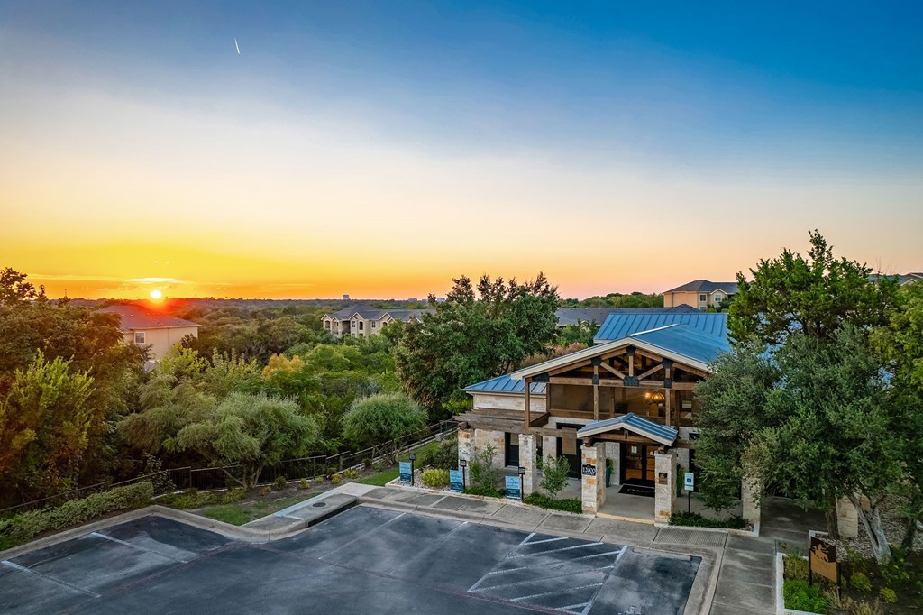 a house with a sunset in the background