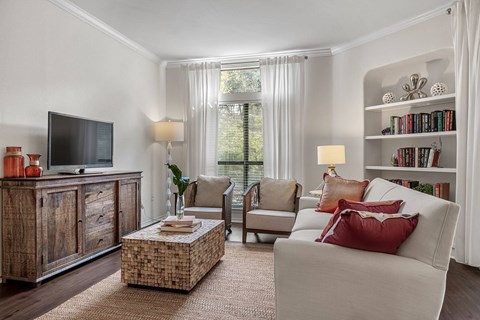 a living room with a couch and a tv