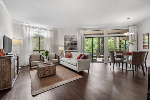 a living room and dining room with a couch and a table