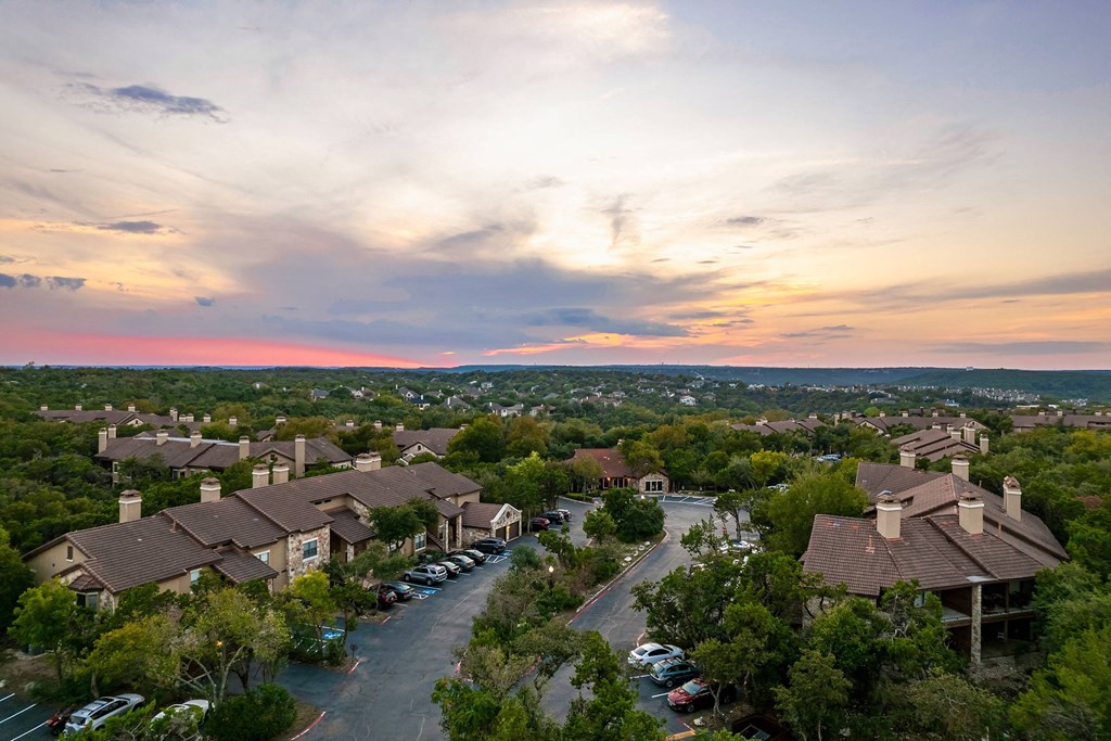 an aerial view of a neighborhood with houses and a river