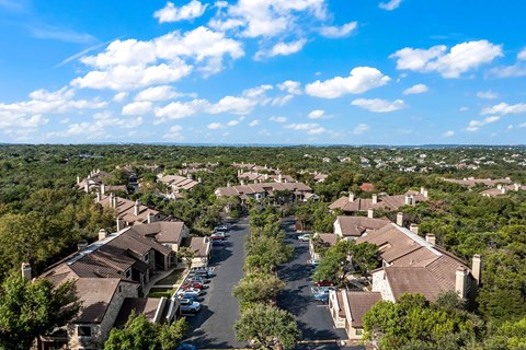 an aerial view of a neighborhood with houses and trees