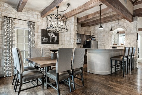 a kitchen and dining room with a table and chairs