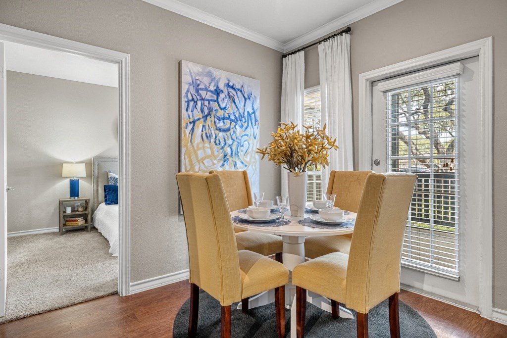 a dining room with a table and chairs