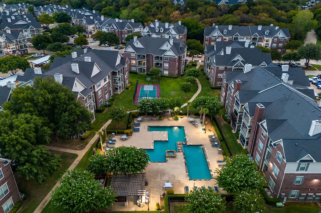 an aerial view of the pool at the apartments