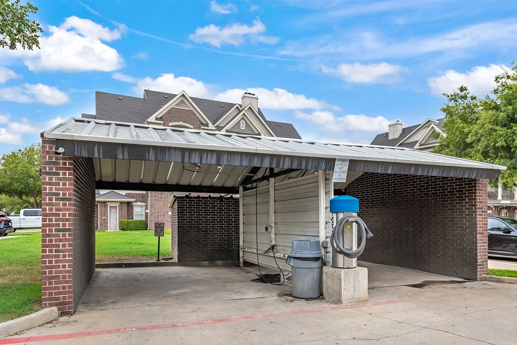 a gas station with a fire hydrant in front of a building