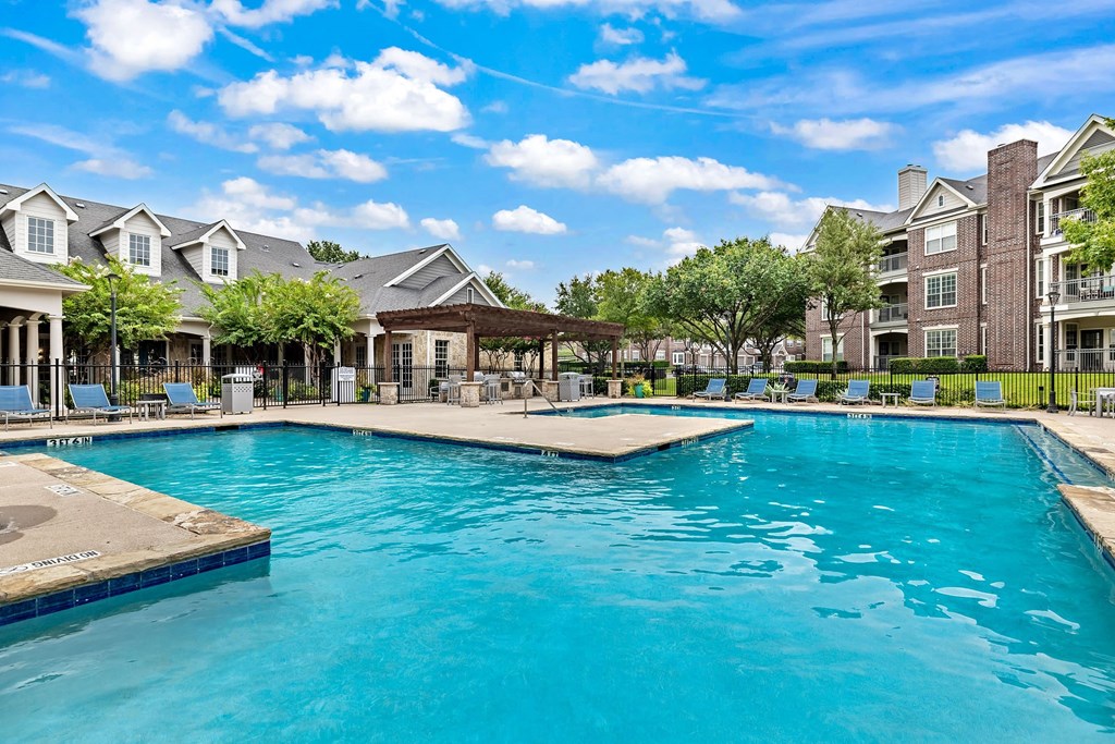 the swimming pool at the residence on lamar apartment homes for rent