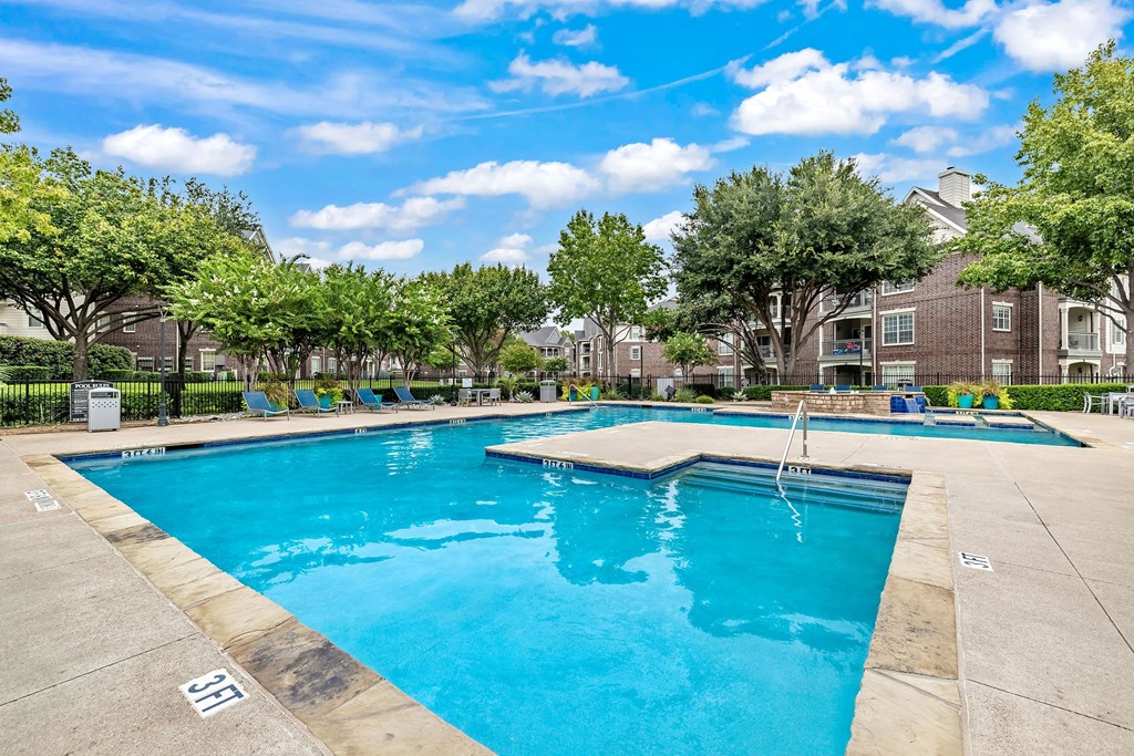 the swimming pool at the estates apartments