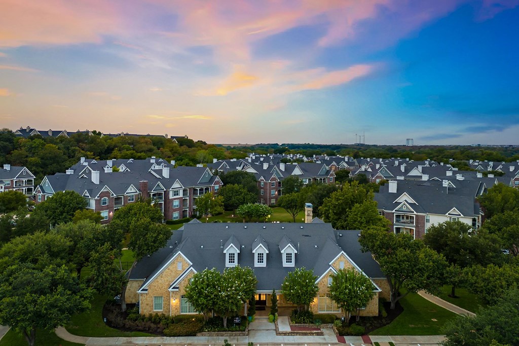 an aerial view of a neighborhood with rows of houses