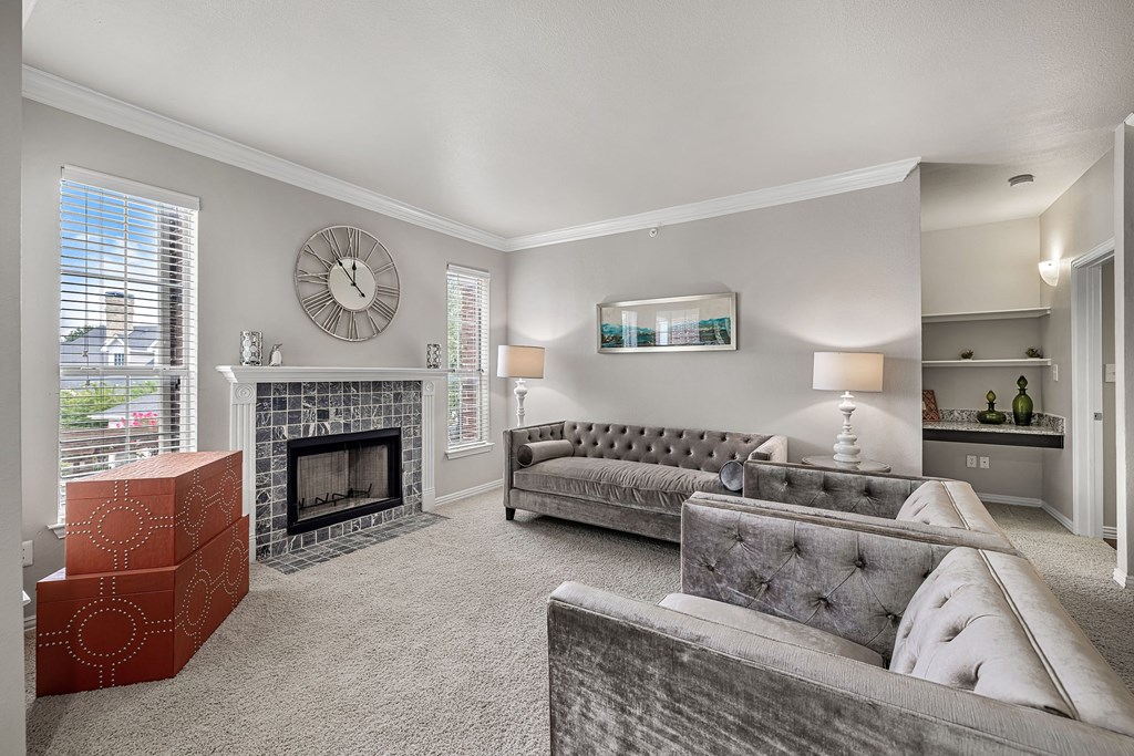 a living room with couches and a fireplace