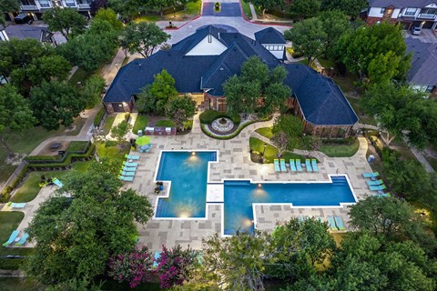 A large backyard with a pool and a deck.