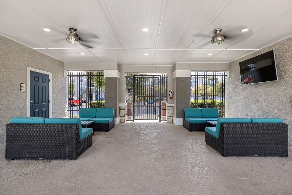 a lobby with couches and a tv