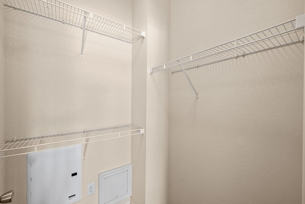 a walk in closet in a 555 waverly unit