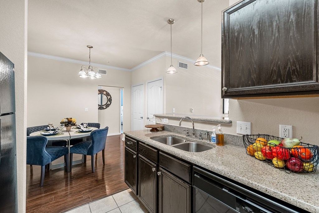 a kitchen and dining area in a 555 waverly unit