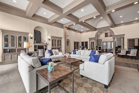 A spacious living room with a large sofa set and a coffee table.