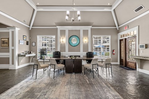 A dining room with a table set for six.