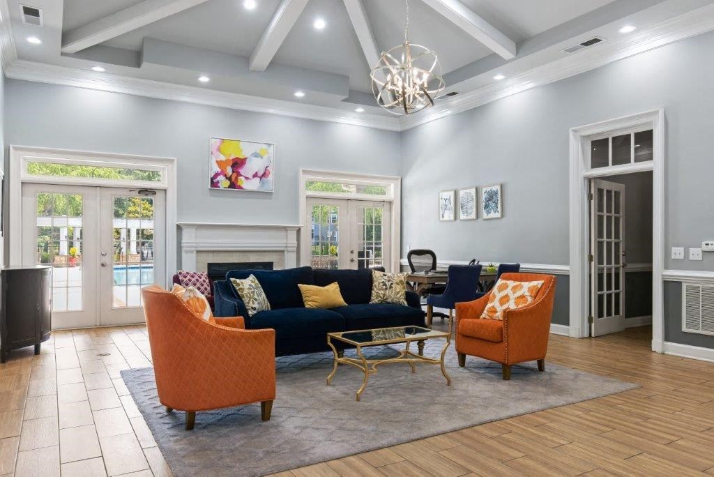 a living room with a couch and chairs and a fireplace