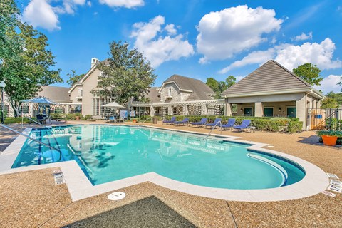 Marquis Champions Forest sparkling swimming pool with lounge seating and gazebos