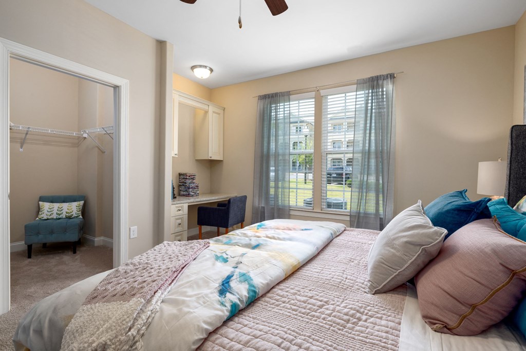 a bedroom with a large bed and a closet