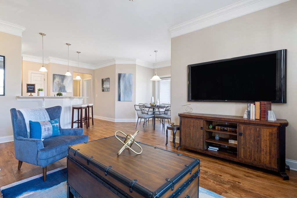 a living room with a large tv and a couch