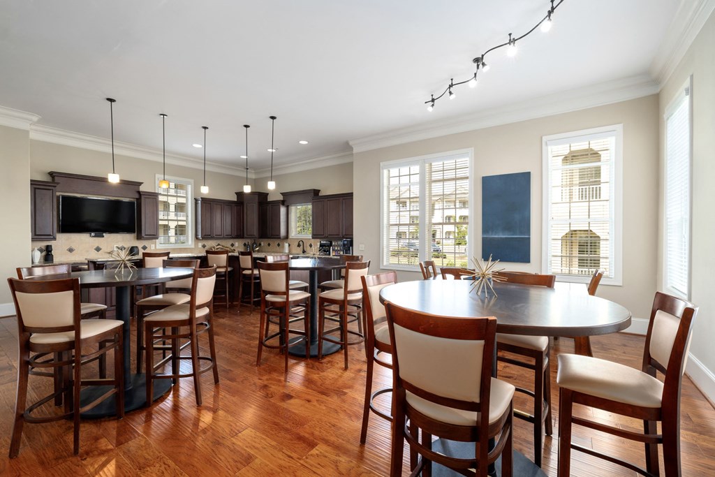 a kitchen and dining room with a table and chairs