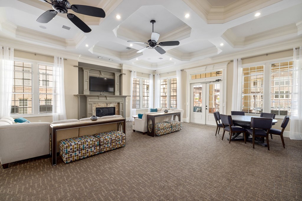 the preserve at cardinal woods resident lounge and dining room area with fireplace