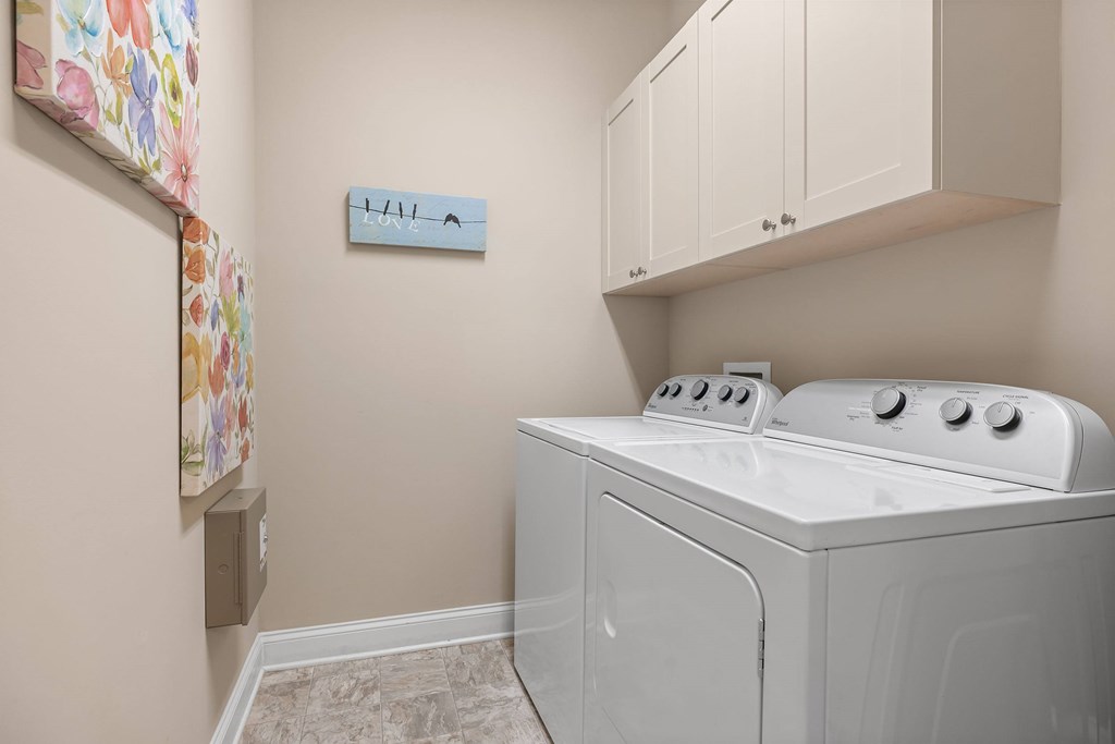 A washer and dryer in a small laundry room.