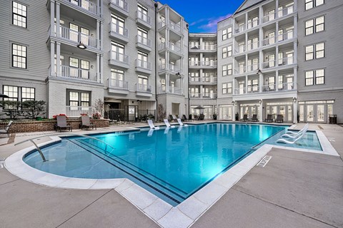 a swimming pool in the middle of an apartment building