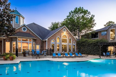 A large house with a pool in the backyard.
