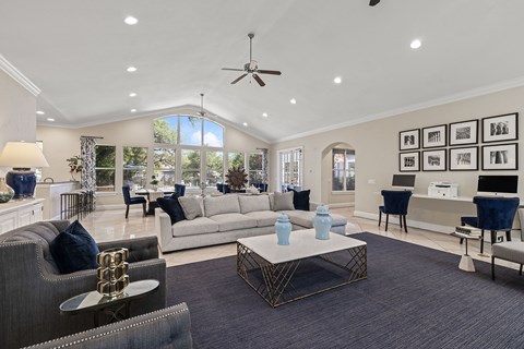 A living room with a grey sofa and a coffee table.