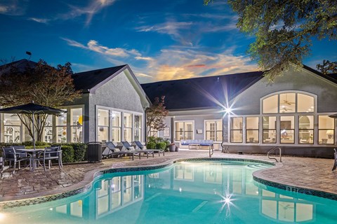 Resort style pool with lounge seating.