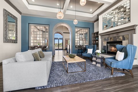 A living room with a fireplace and a white couch.