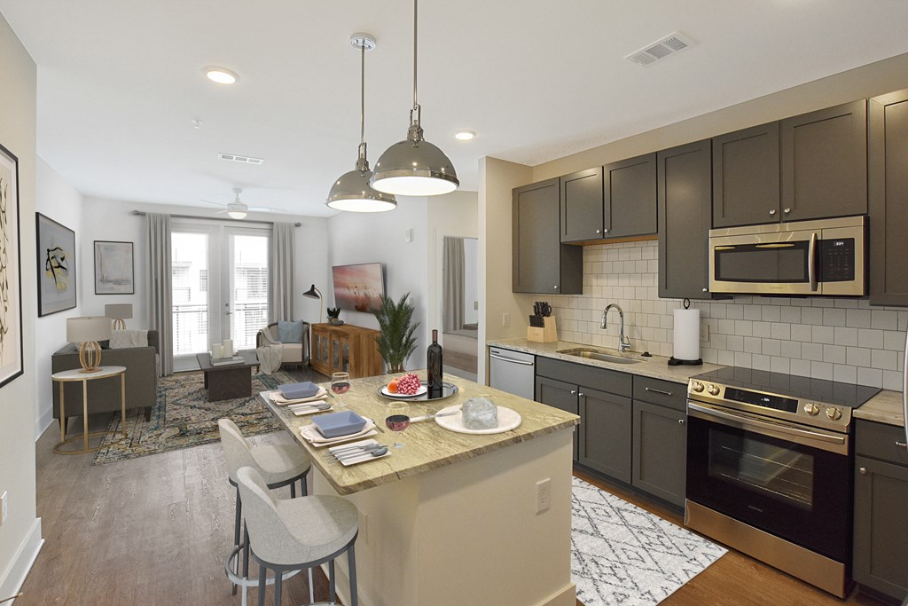 an open kitchen and living room with a table and chairs