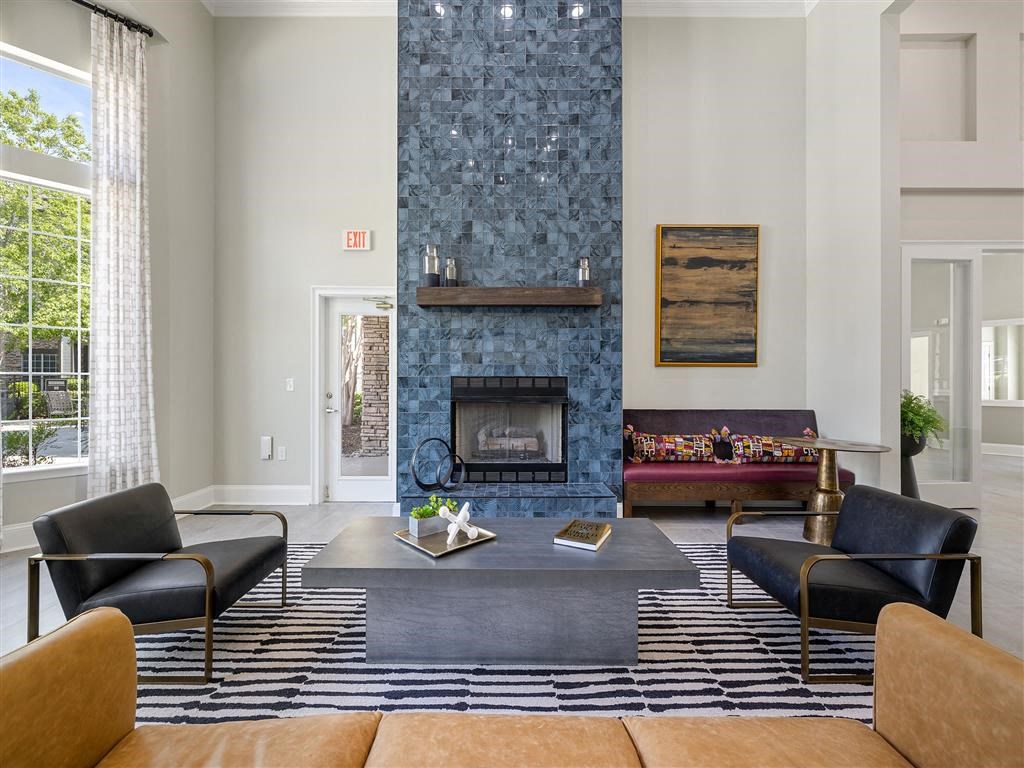 a living room with furniture and a fireplace